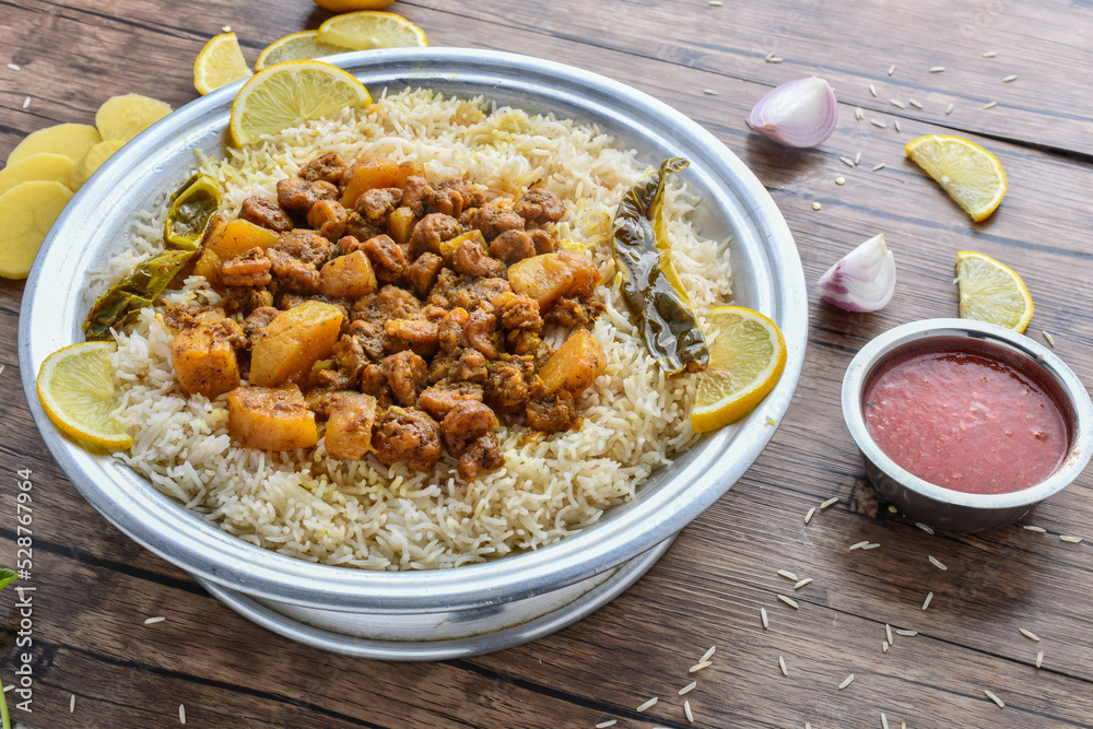 Arabian shrimp mandi with lime slice and sauce served in dish top view of middle east food Arabian shrimp mandi with lime slice and sauce served in dish top view of middle east food