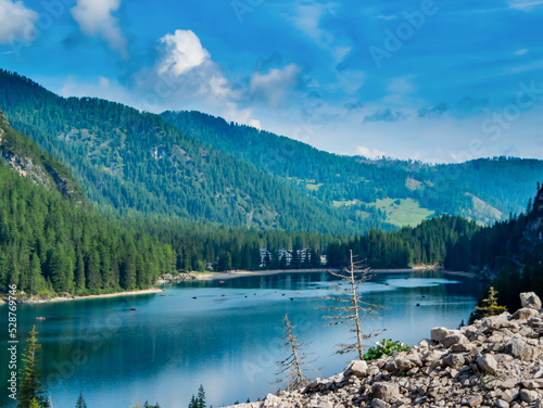 The beautiful blue and clear Lago di Braies lake in the Dolomites below the Seekofel mountain