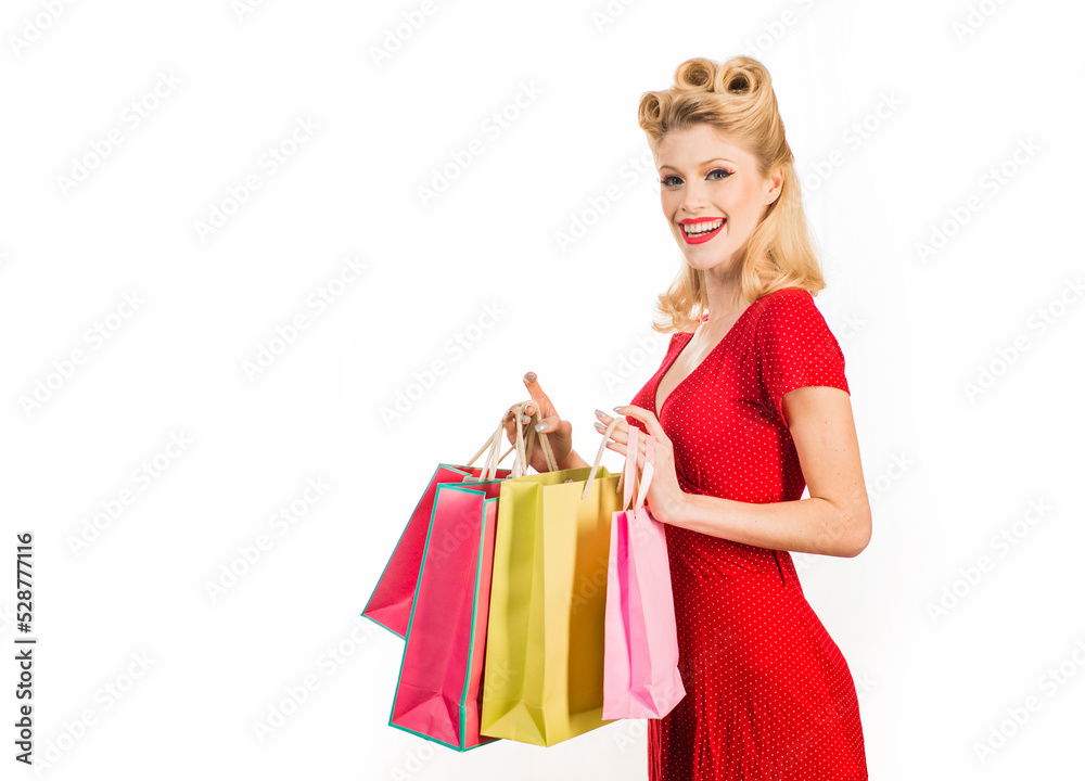 Pinup woman shopping. Big sales. Pretty lady shopaholic. Isolated. Pinup woman shopping. Big sales. Pretty lady shopaholic. Isolated.