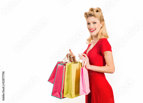 Pinup woman shopping. Big sales. Pretty lady shopaholic. Isolated.