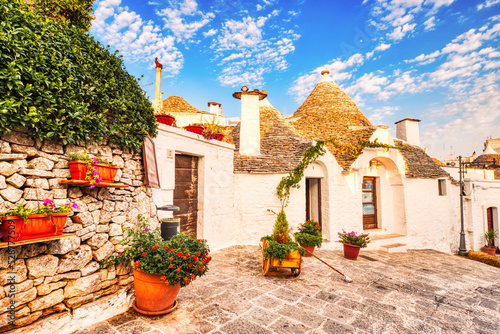 Famous Trulli Houses during a Sunny Day with Bright Blue Sky in Alberobello, Puglia