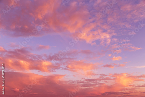 Dramatic soft sunrise, sunset pink violet orange sky with clouds background texture © Viktor Iden