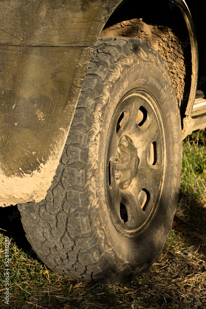 off-road wheel. SUV. mud on the wheel. tire close up.