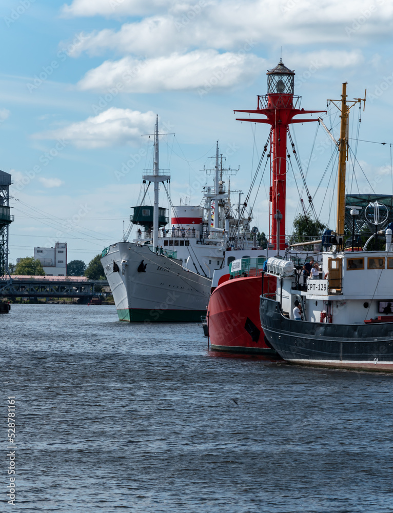 Embankment of the Pregol River overlooking the Museum of Oceanology in the city of Kaliningrad, Russia. Kalingrad, keninsberg, summer tourism in russia. order on the water, seaport Embankment of the Pregol River overlooking the Museum of Oceanology in the city of Kaliningrad, Russia. Kalingrad, keninsberg, summer tourism in russia. order on the water, seaport