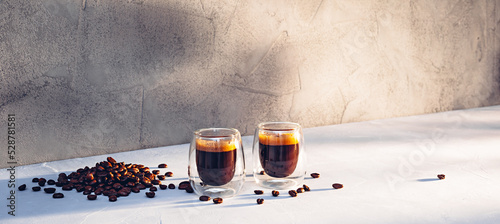 Canvas Print Two glass cups of espresso with coffee crema