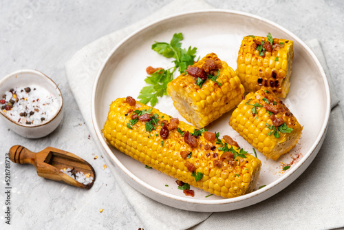 Grilled sweet corn with paprika salt and parsley