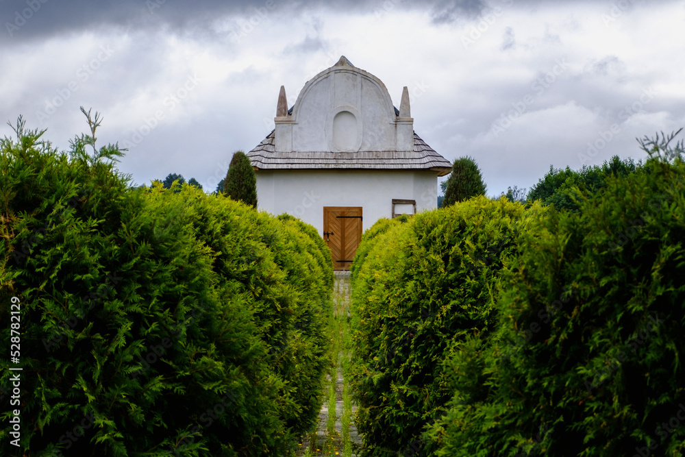 A chapel surrounded by greenery at cloudy day A chapel surrounded by greenery at cloudy day