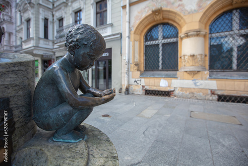 Children and fish fountain in Łódź, Poland