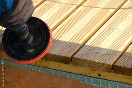Принти на полотні processing the board with an emery nozzle, smoothing and cleaning the wood texture with an emery disc, sanding the wooden material