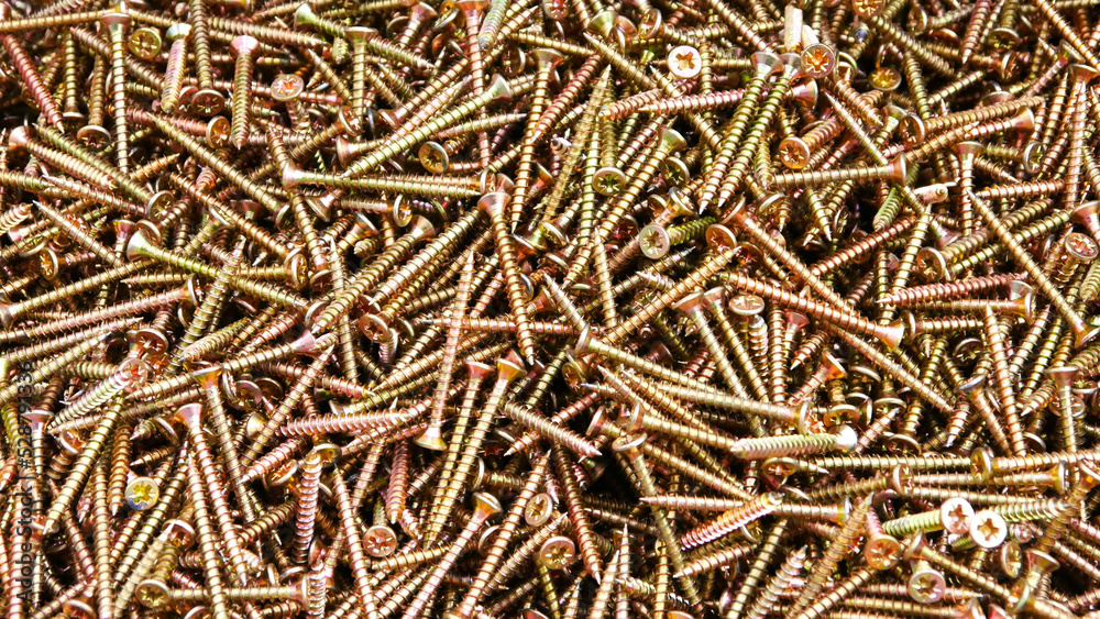 A big pile of beautiful bronze screws A big pile of beautiful bronze screws
