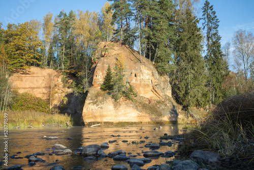 Zvartes cliff on river Amata, Latvia with sky. photo