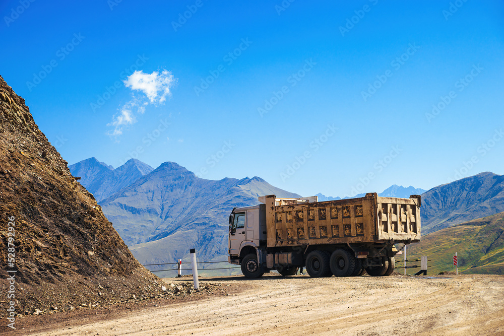 Heavy freight truck crossing highland Datvisjvari Pass in Khevsureti region of Georgia.