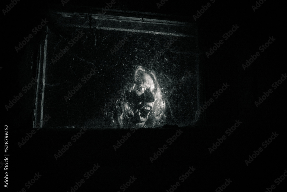 scary woman behind window at night Halloween horror background scary woman behind window at night Halloween horror background