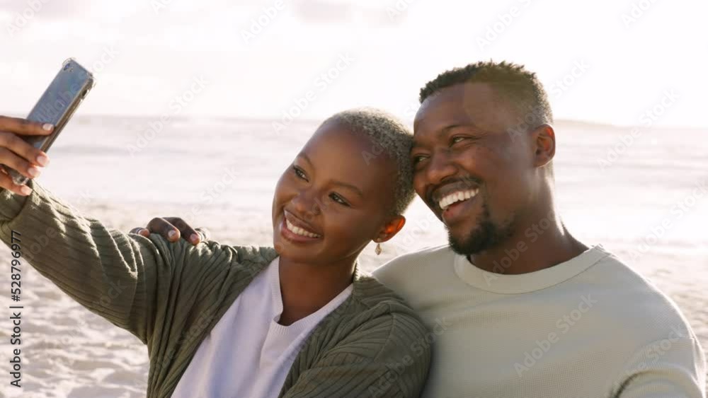 Happy, selfie and couple love at beach with 5g network phone photography of sunset for social media, internet or website app. Smile, black woman and man with tech while travel, ocean and picnic.