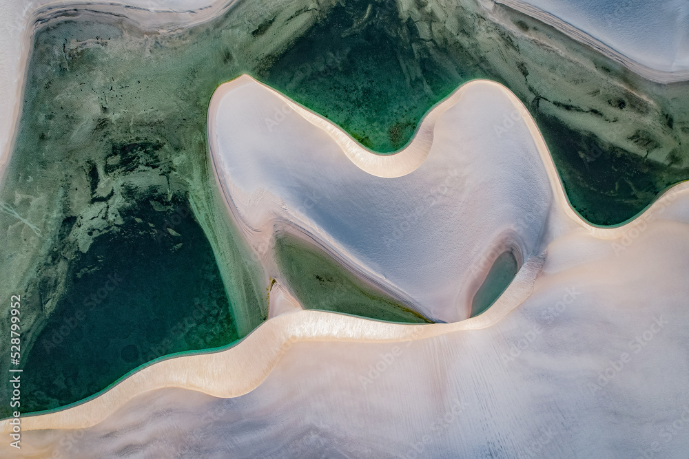 White sand dunes among lakes with blue water, aerial view White sand dunes among lakes with blue water, aerial view