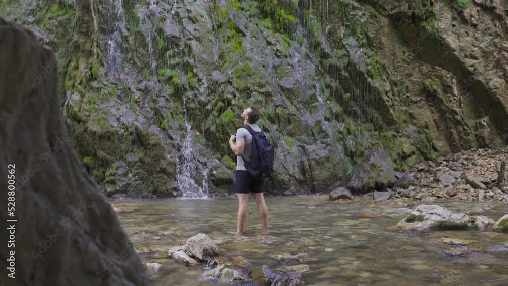 Young free man in front of waterfall.
Free-spirited young man watches nature in front of the waterfall.
Young free man in front of waterfall.
Free-spirited young man watches nature in front of the waterfall.