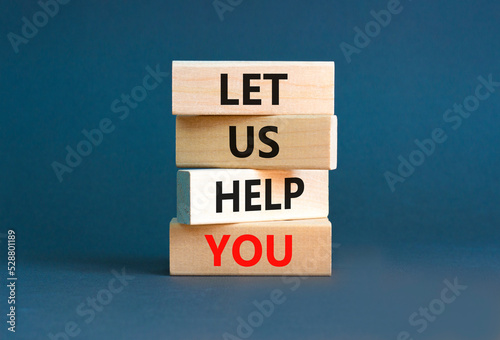 Support and let us help you symbol. Concept words Let us help you on wooden blocks on a beautiful grey table grey background. Business, support and let us help you concept.