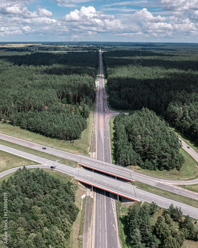 Multi-lane highway bridges over road in the countryside