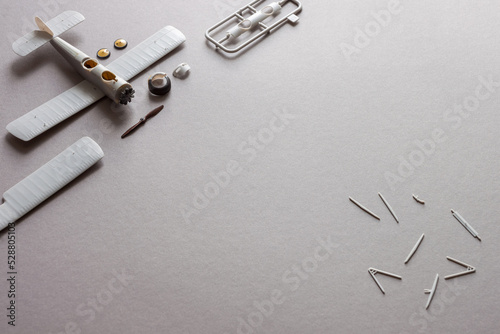 Scale model of the airplane fighter with details. Plastic assembly kit. Top view. Copy space