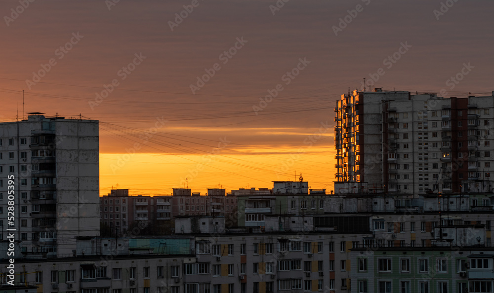 Sunlit multi-storey residential buildings in the residential area of Yasenevo in the south of the Russian capital at dawn.