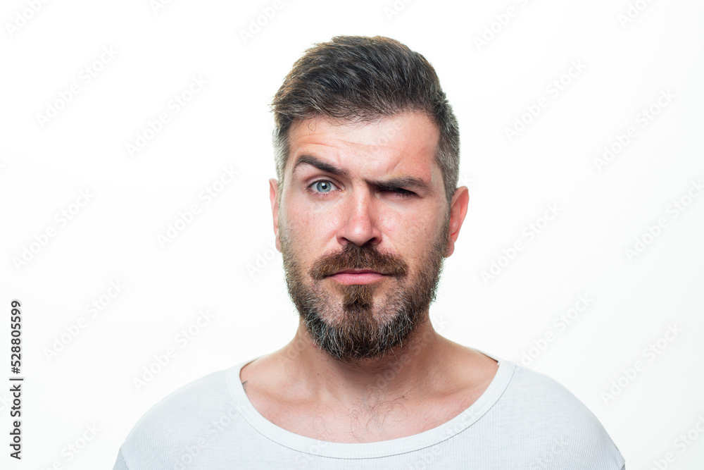 Serious man portrait. Beard and mustache. Looks seriously. Isolated. Hipster guy face expression. Closeup face. Serious man portrait. Beard and mustache. Looks seriously. Isolated. Hipster guy face expression. Closeup face.