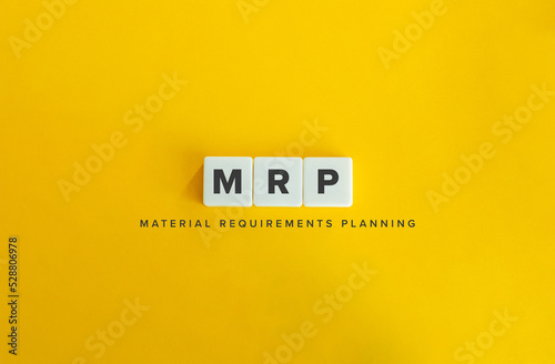 Material Requirements Planning (MRP) Banner. Letter Tiles on Yellow Background. Minimal Aesthetics. photo