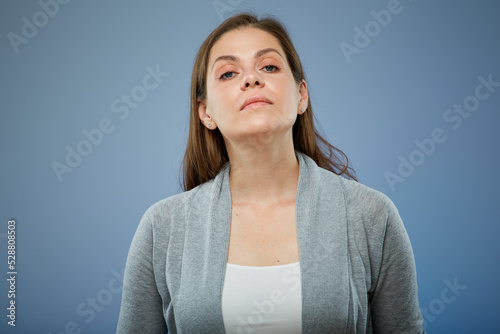 Confident woman isolated portrait on blue.