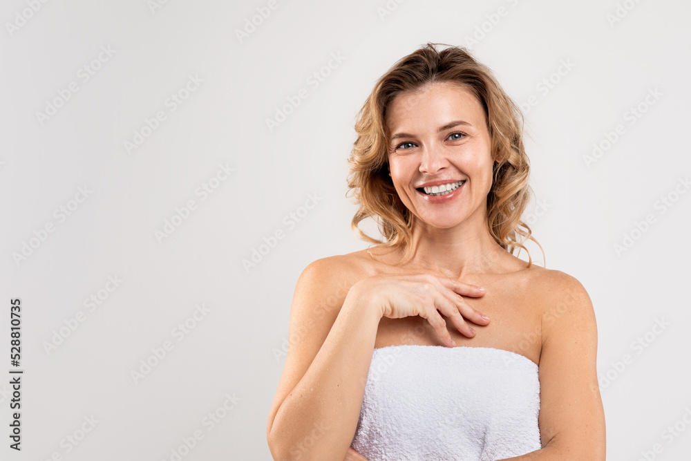 Self-Care Concept. Portrait Of Attractive Middle Aged Female Wrapped In Bath Towel Self-Care Concept. Portrait Of Attractive Middle Aged Female Wrapped In Bath Towel