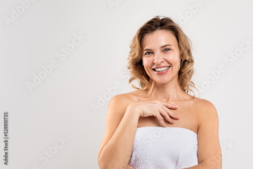 Self-Care Concept. Portrait Of Attractive Middle Aged Female Wrapped In Bath Towel