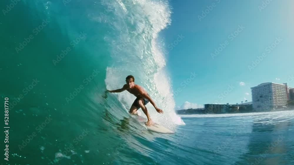 Surfer on blue ocean wave getting epic barrel, Surfing extreme sport, HD Slow motion