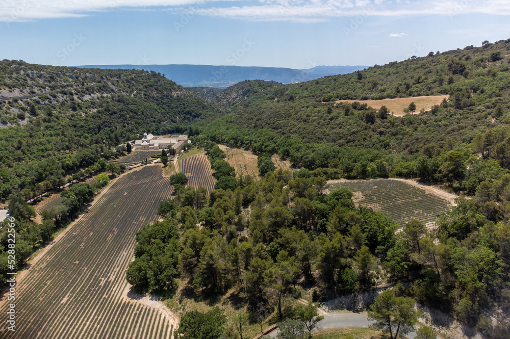 Aerial view on abbey of Senanque, hills and blossoming lavender fields, Provence, Luberon, France Aerial view on abbey of Senanque, hills and blossoming lavender fields, Provence, Luberon, France