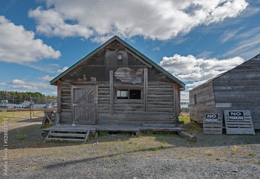 Old log building next to Great Slave Lake in the city of Yellowknife in the Northwest Territories, Canada