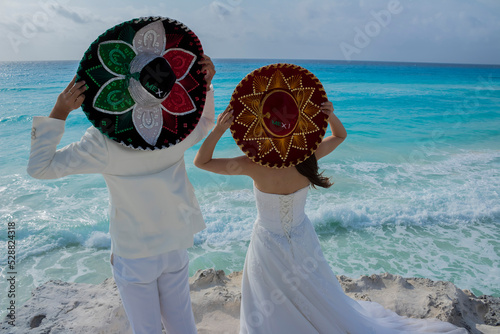 Wedding couple are modeling some mexican charro hat