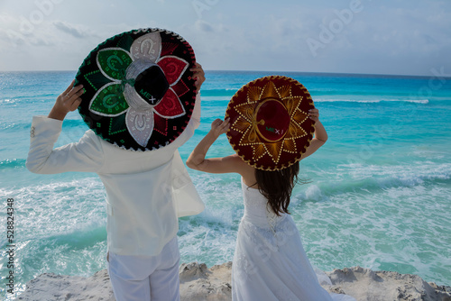 Wedding couple are modeling some mexican charro hat