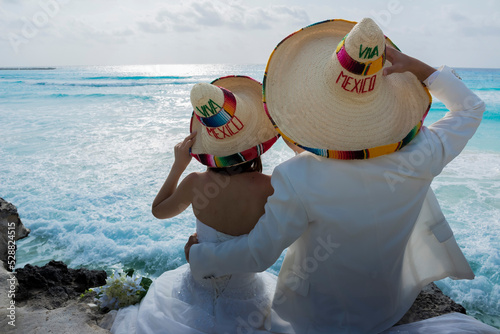 Wedding couple are modeling some mexican charro hat