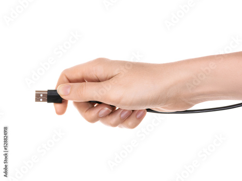 A woman's hand holds a cable with a usb connector. The concept of connecting a computer device. Isolated on white background.