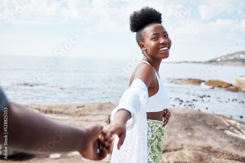 Summer, sea and smile, a black couple holding hands and walking on the beach. Nature, love and freedom on romantic weekend, a black woman and man by the ocean. Holiday, adventure and romance with POV #528825353
