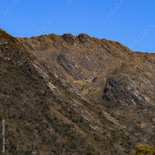 Rocky montains with frailejones close to San Pedro de Iguaque in Colombia on a beautiful blue sky day.