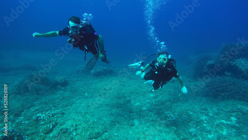 Couple SCUBA Diving Off the Coast of Mallorca Spain