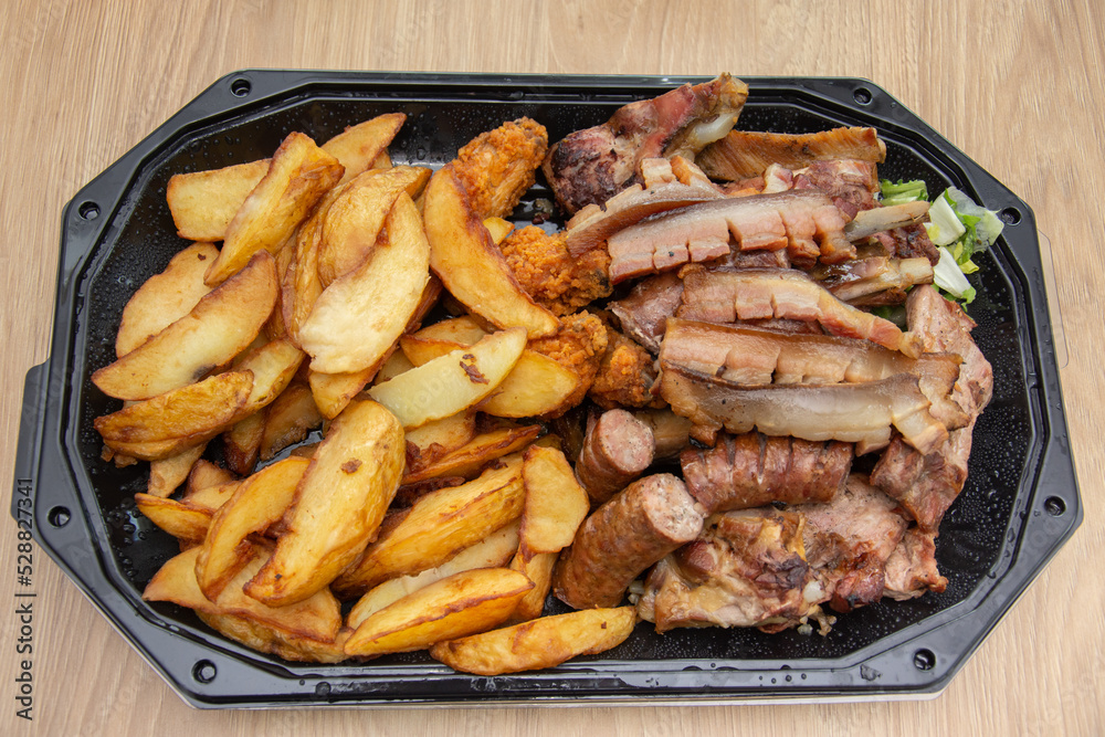 Plate with fried potatoes and smoked meat Plate with fried potatoes and smoked meat