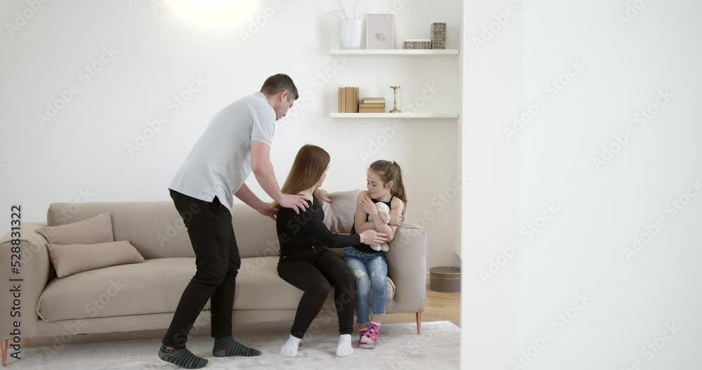 Young couple and their daughter in family conflict concept Young couple and their daughter in family conflict concept