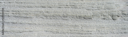 Erosion in sandstone rock cliff, patterns and textures in nature as a background
