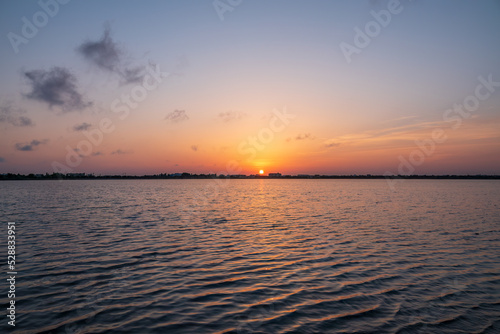 The sun goes down over a lake