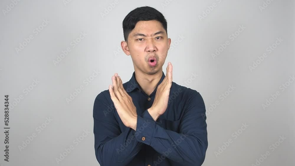 Asian man say no cross arms disagree sign white background