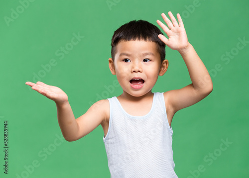 Asian little boy over green background