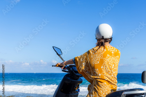 Travel Woman ride a motor bike in liuqiu island at Taiwan photo