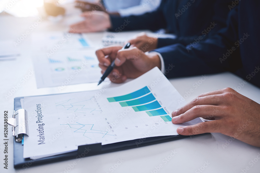 Marketing chart graphs, sales and advertising goals or projections checklist and paperwork results by the manager. Employee reading financial profit data analytics while planning a finance strategy