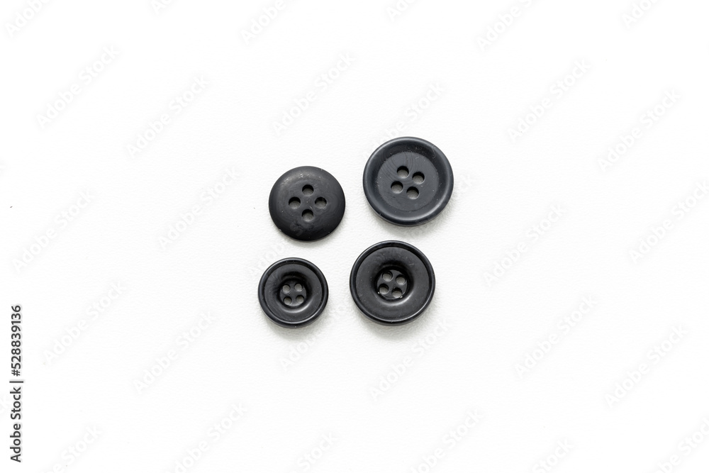 Buttons for sewing isolated on white background. Clothes button. Product. Black buttons. Buttons for sewing isolated on white background. Clothes button. Product. Black buttons.