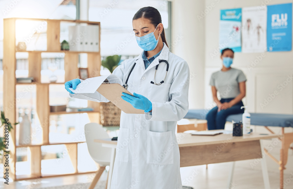 Doctor with mask and patient for medical test results documents at hospital in covid or corona global pandemic. Consulting healthcare woman worker with health insurance paperwork of sick girl Doctor with mask and patient for medical test results documents at hospital in covid or corona global pandemic. Consulting healthcare woman worker with health insurance paperwork of sick girl