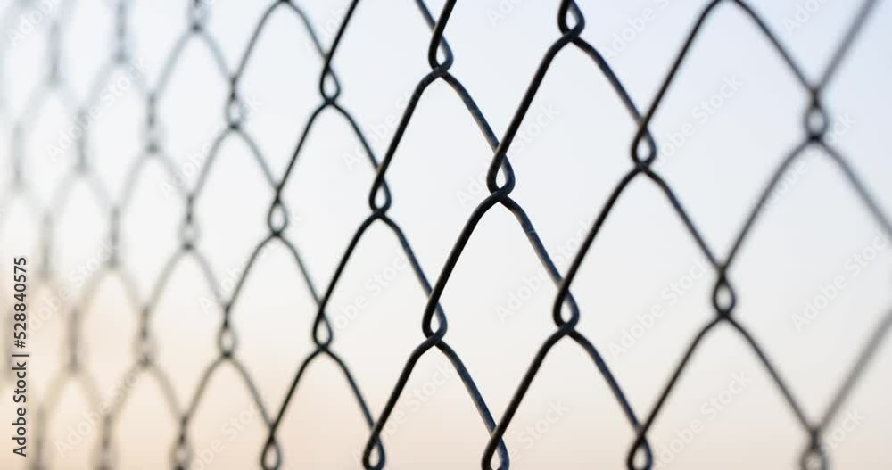 Chain link fence closeup. Mesh netting on gray background Chain link fence closeup. Mesh netting on gray background